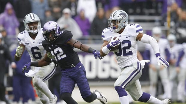 Dec 3, 2016; Fort Worth, TX, USA; Kansas State Wildcats running back Justin Silmon (32) carries the ball past TCU Horned Frogs cornerback Jeff Gladney (12) during the first half of an NCAA football game at Amon G. Carter Stadium.